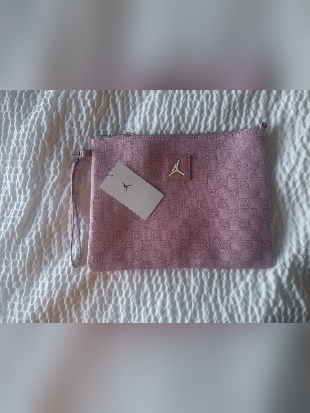 Jordan Pink Embossed Wristlet Clutch